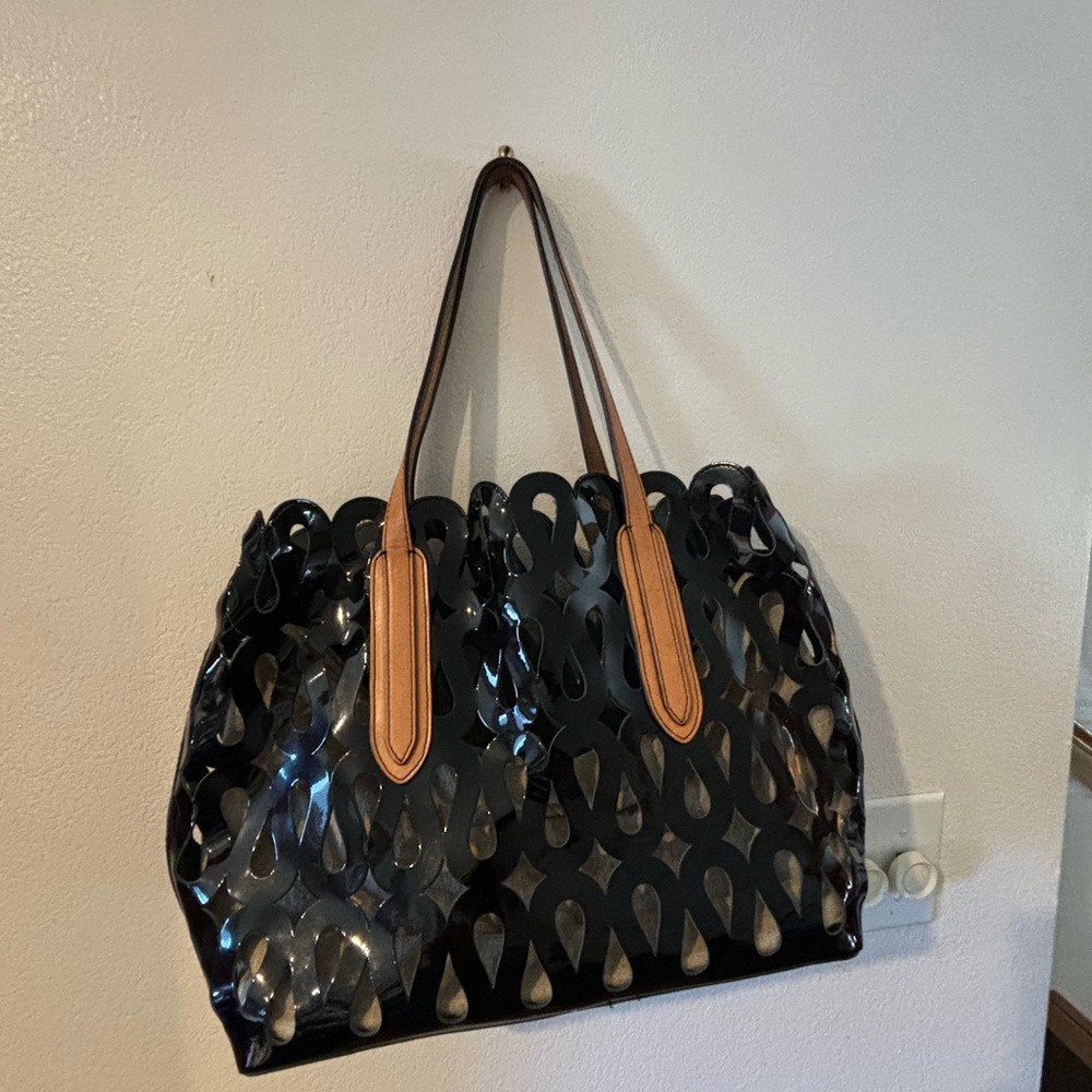 Black patent bag with linen fabric insert and leather handles